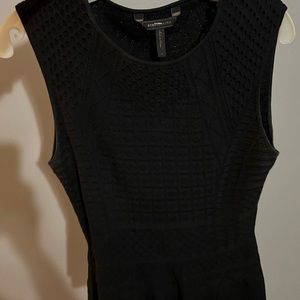 Black knit sleeveless top.